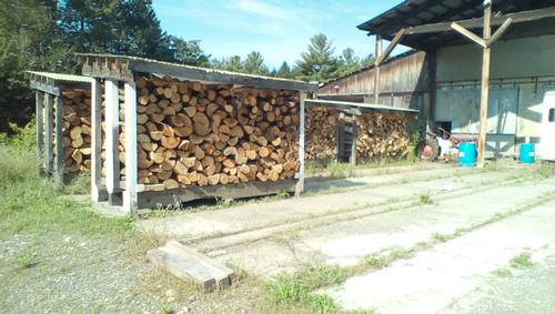Firewood airdrying on racks