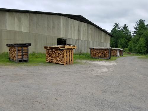 Racks of firewood drying in the breeze