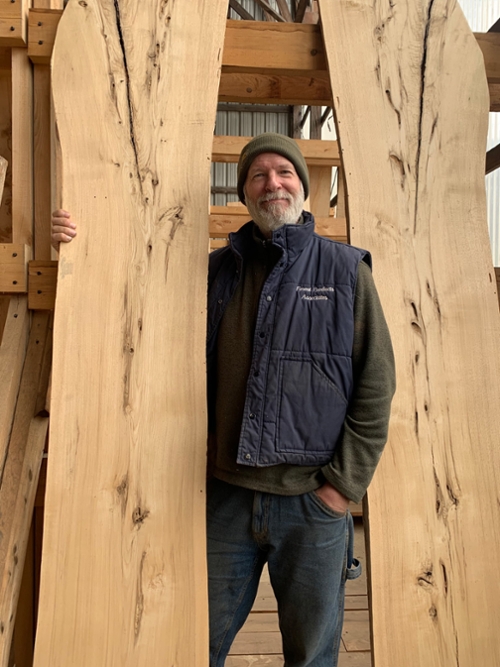 Jeff with two live edge slabs of wood